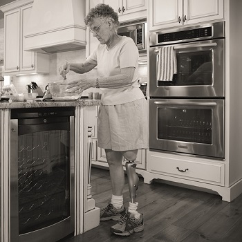 woman with kenevo standing and cooking